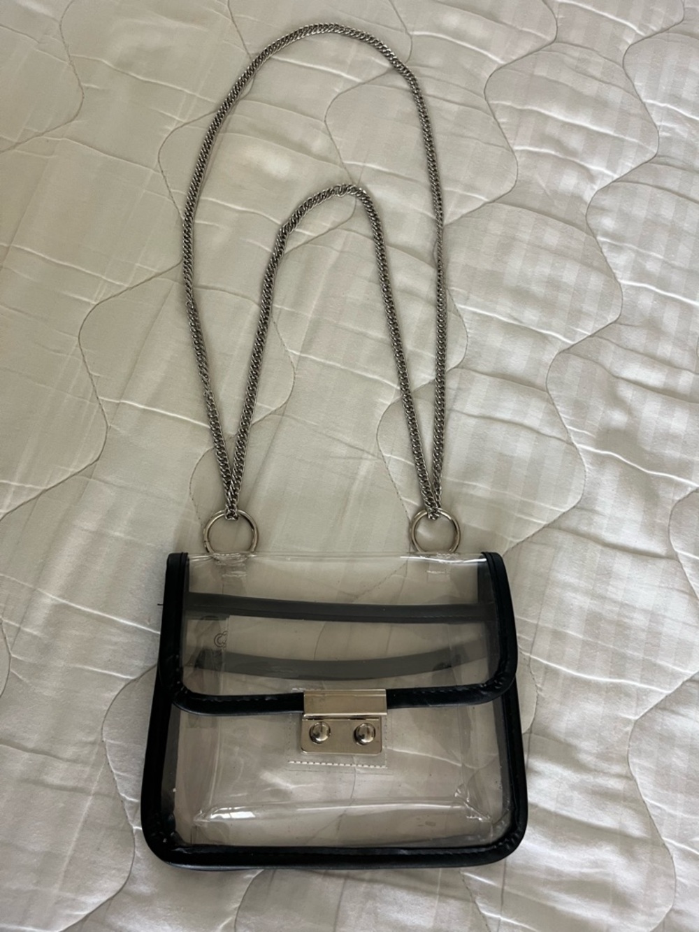 Chic Stadium Bag
Clear PVC Crossbody Bag with Black Trim and Silver Chain